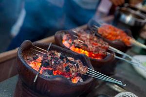 Indonesian food Satay Jogja klatak meat being grill