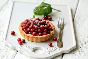 Tart with cranberries and mascarpone cheese photo
