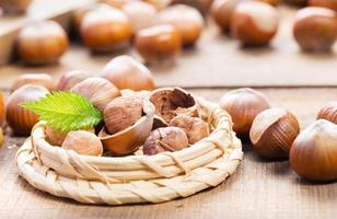 Hazelnuts on wooden background photo