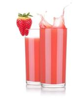 Smoothies of strawberry in glass with splash