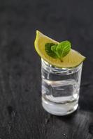 Mojito ingredients - rum, mint, lime slice