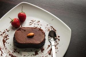 Dessert chocolate cake on a white plate. photo