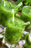 Fresh green juice with kiwi and ice photo