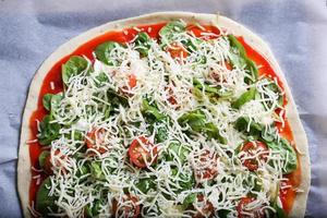 Pizza with spinach photo