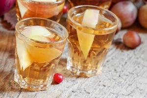 Apple juice with slices of fresh apples photo