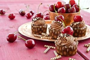 Chocolate cupcakes with cherries photo