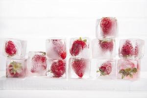Ice cubes with strawberries photo