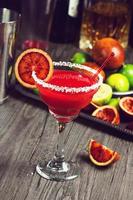 Blood Orange Margarita on Bar with Ingredients photo