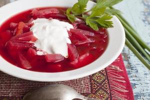 Beetroot soup with potatoes, cabbage and sour cream. photo