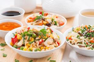 Asian lunch - fried rice with tofu, noodles, vegetables photo