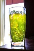 Bubbles in soft drinks with glass cup photo