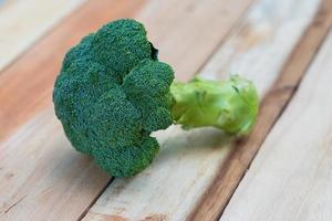 Fresh broccoli on wooden background,broccoli wooden table photo