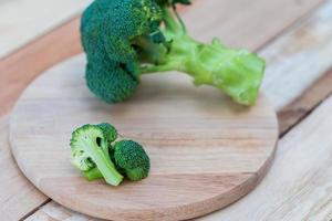 Fresh broccoli on wooden background,broccoli wooden table photo