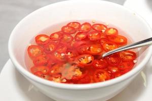 Vinegar with chili in a bowl.