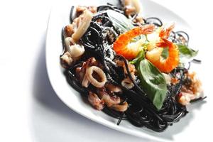 Black spaghetti with seafood photo