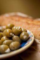 Green olives tapas and baguette