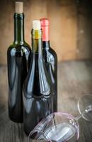 Bottles with red wine photo