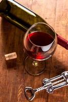 Red wine in vintage setting photo