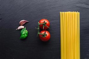Pasta ingredients on black
