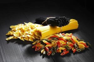 Variety of types and shapes of Italian pasta photo