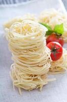 Dry pasta with fresh basil photo