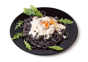 Black pasta with seafood sauce photo