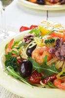 Seafood spaghetti pasta dish with octopus and shrimps photo