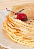 pancakes with chocolate and cherries photo