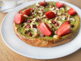 cake with strawberries, rhubarb and cashew nuts photo