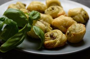 Puff pastry rolls with italian pesto filling photo