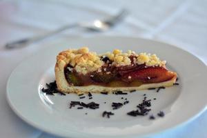 Portion Of Plum Cake On A White Plate