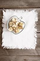 dried apples on wood table photo