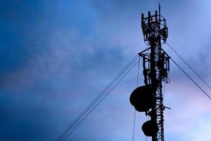 Telecommunication antenna in twilight sky photo