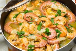 Shrimp cooking with parsley photo