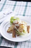 Caesar Salad on white plate photo