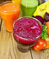 Juice beetroot and vegetable on board top photo