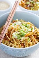 Stir fry with noodles, cabbage and carrot photo