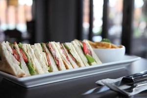 Club sandwich with on wood background photo