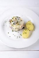 herring salad with jacket potatoes photo