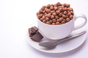 bowl with chocolate flakes balls isolated