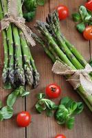 organic asparagus on wooden table photo