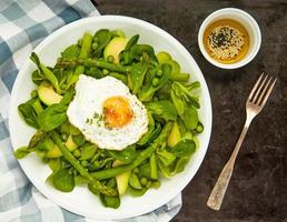 Healthy spring green salad with egg