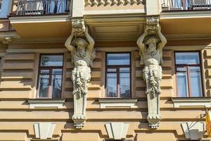 The sculpture on the house on the embankment of Griboedov channel photo