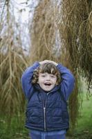 Portrait of a happy little boy outdoors photo