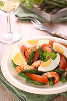 Fresh salad with asparagus, eggs, shrimp and tomatoes