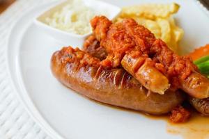 sausage platter with fried potato and vegetable photo