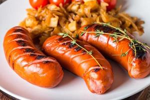 Grilled sausages with cabbage, tomato