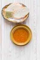 Bowl of minestrone soup with bread photo