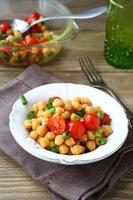 Salad with chickpeas and tomatoes photo