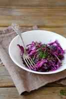 Salad with cabbage and dill in a white bowl